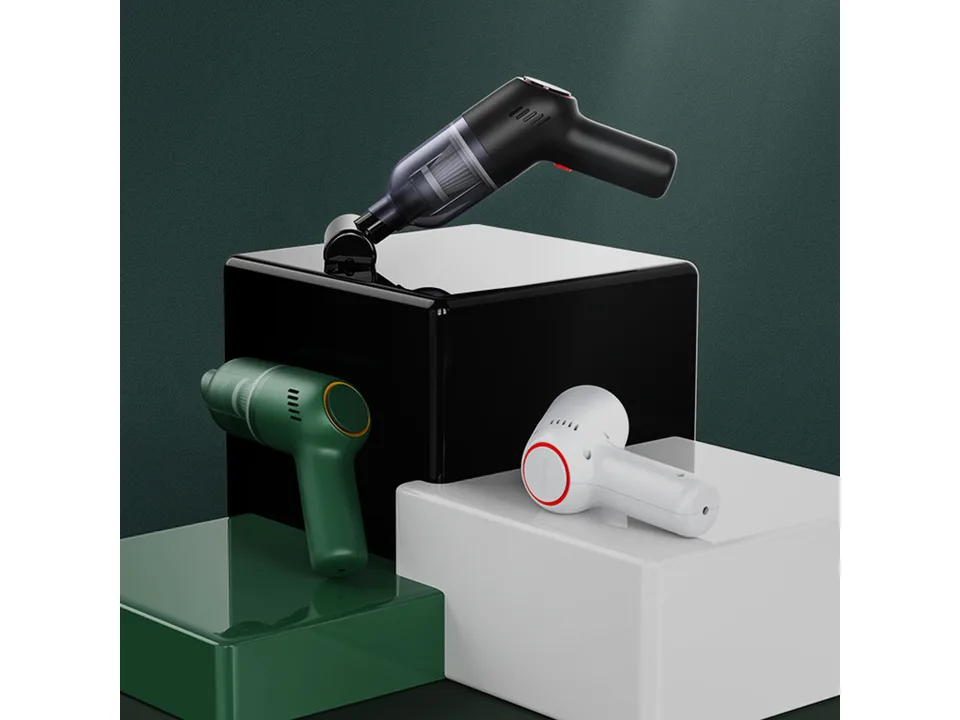 Three handheld vacuum cleaners in black, green, and white displayed on blocks