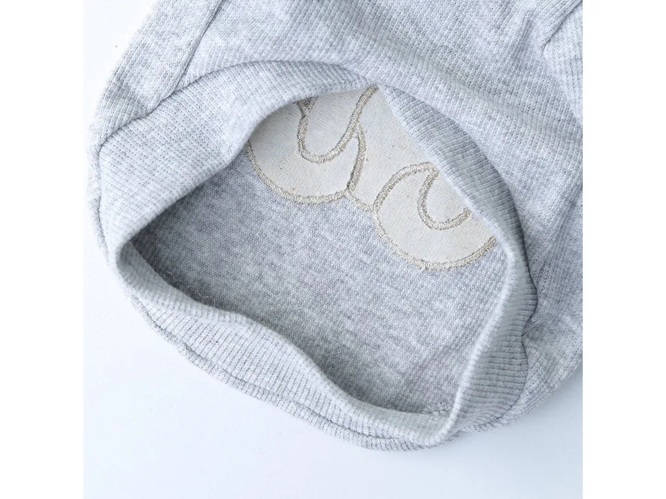 Close-up view of the inside of the pet shirt showing the embroidery stitching.