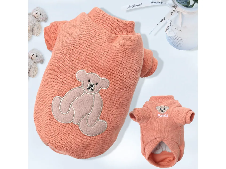 An orange pet shirt with a bear design, shown from both front and back angles.