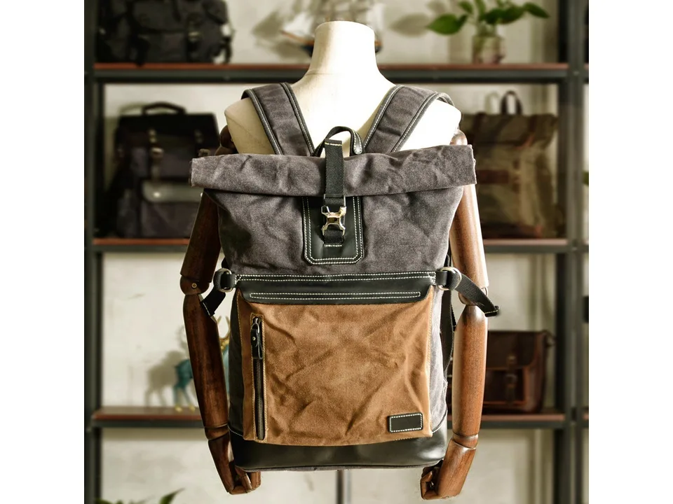 Roll-top backpack displayed on a mannequin torso.