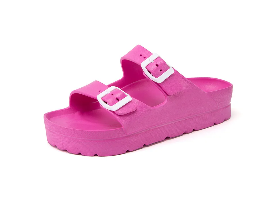 Pink platform slide sandals with white buckles
