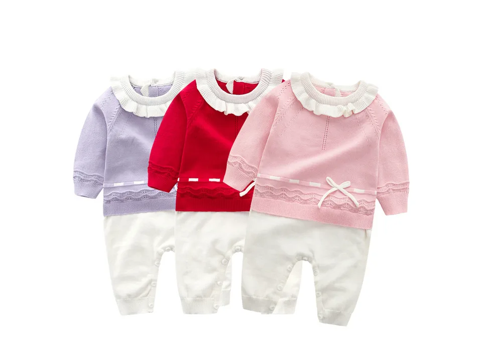 Three baby girl knitted jumpsuits in purple, red, and pink displayed together.