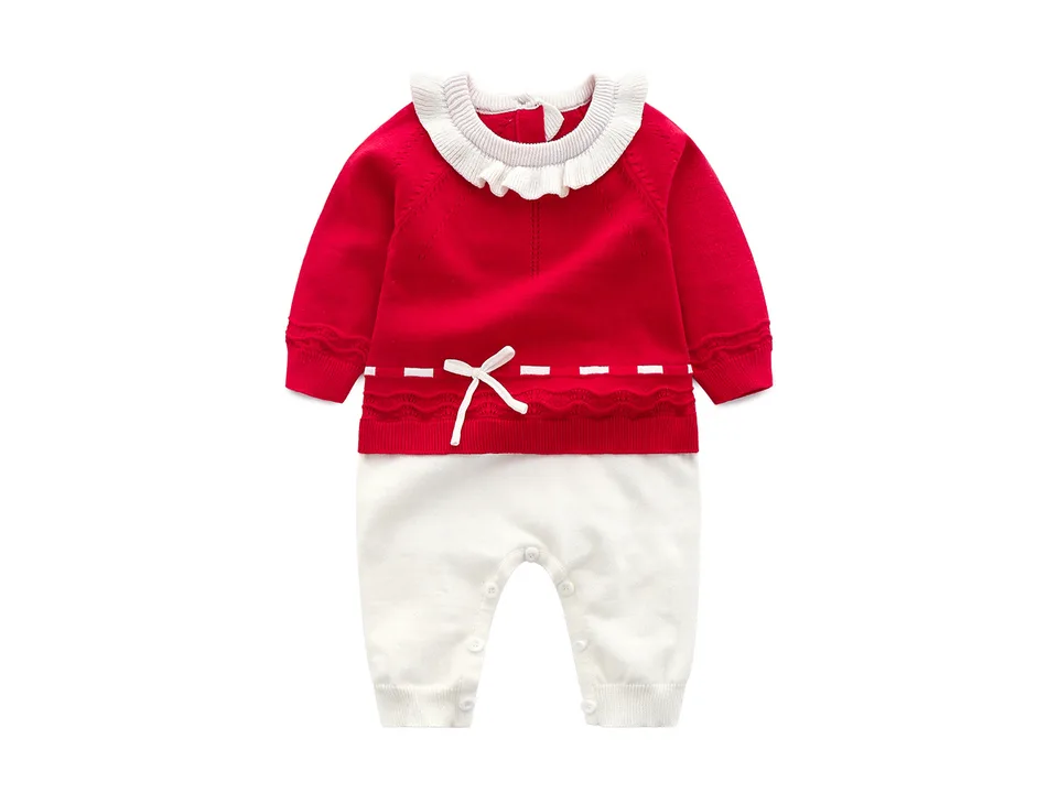 Red baby girl knitted jumpsuit with ruffled collar and white bow detail.