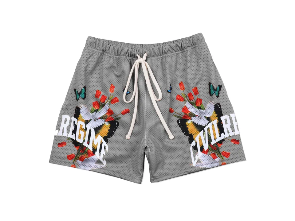 Grey athletic shorts with floral and butterfly graphic print.