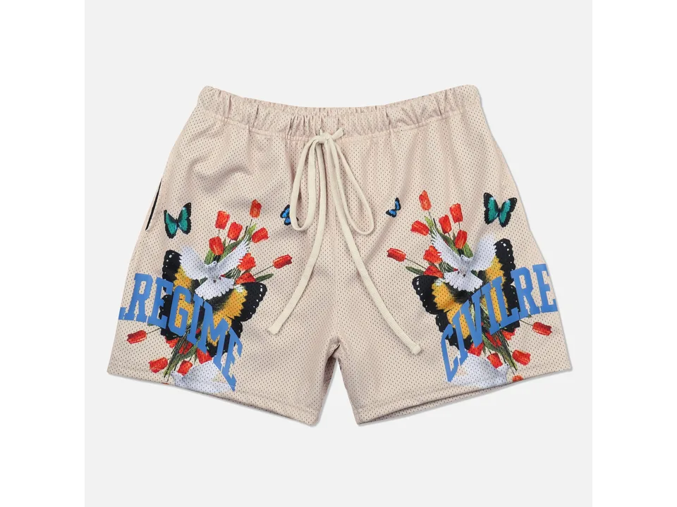 Beige athletic shorts with floral and butterfly graphic print.