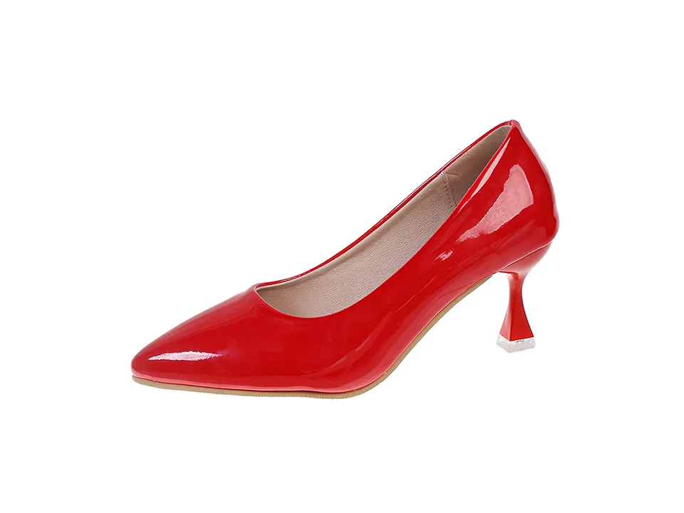 A single red pointed toe stiletto pump on a white background.