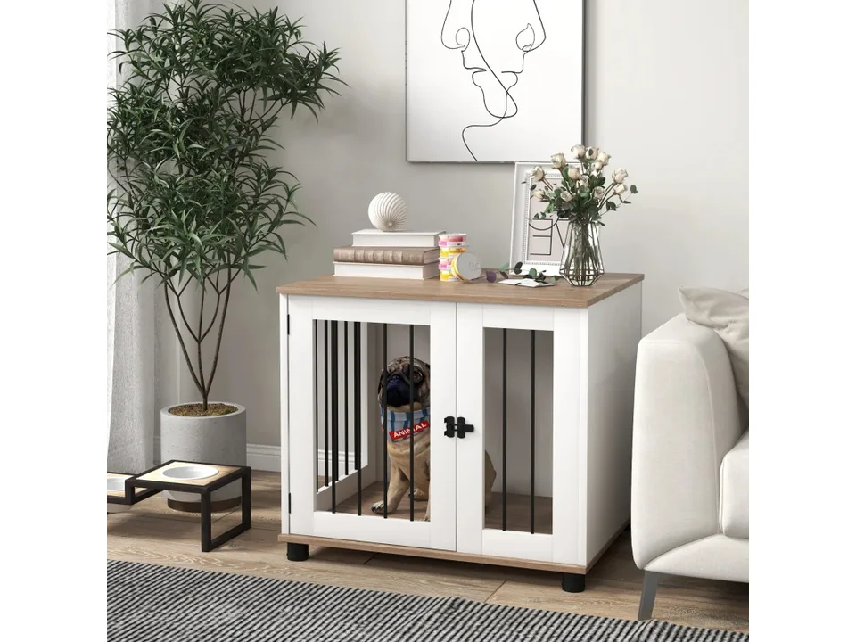 A pug sitting inside the white and wood dog crate end table.