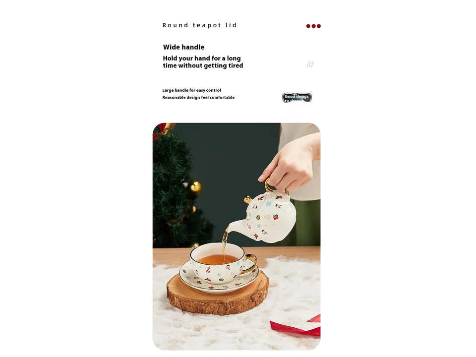 A hand pouring tea from a Christmas-themed ceramic teapot into a matching cup.