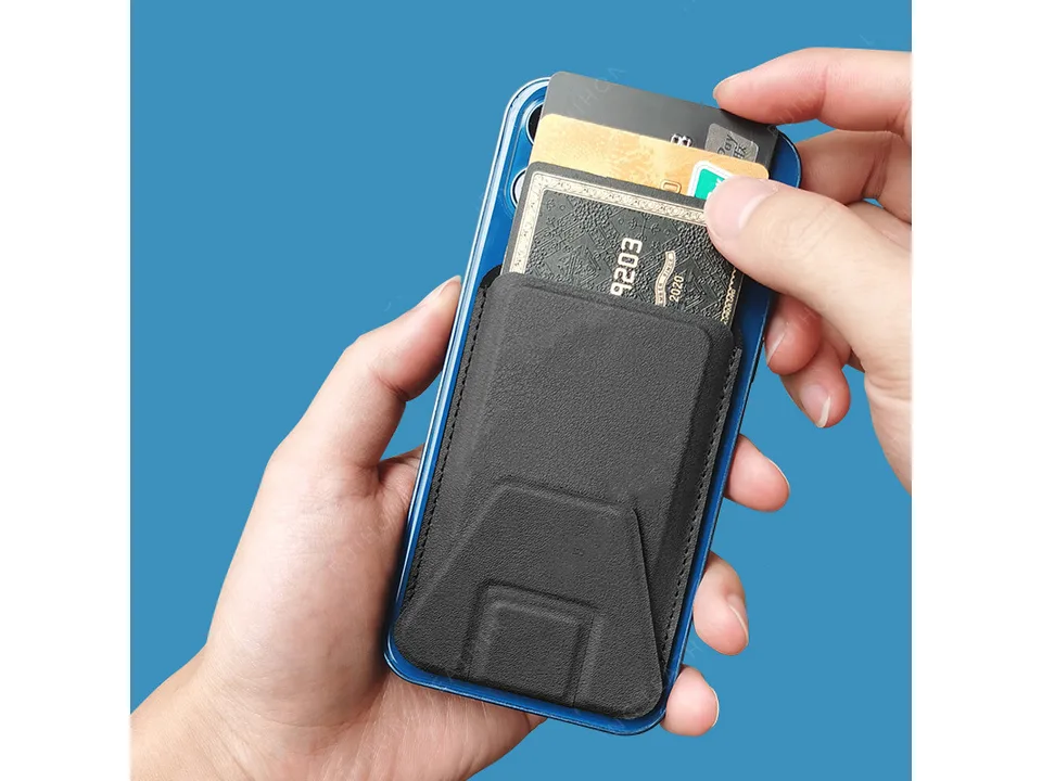Hand inserting credit cards into a magnetic phone wallet