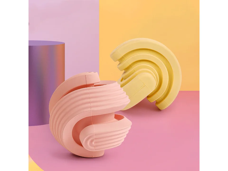 Pink and yellow dog chew toys displayed together