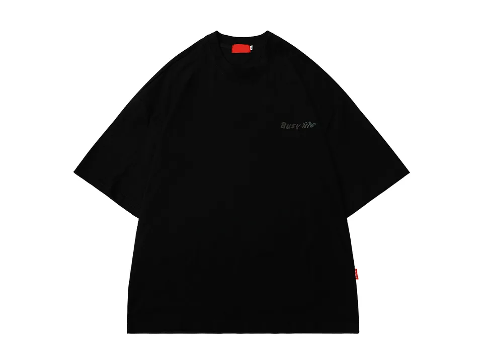 Black oversized t-shirt with small text on the chest.