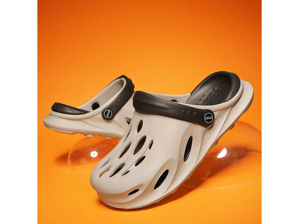 Beige EVA clog slipper with dark brown strap on an orange background.