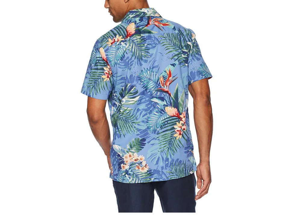 A man seen from the back wearing the blue tropical print short-sleeve button-down shirt.
