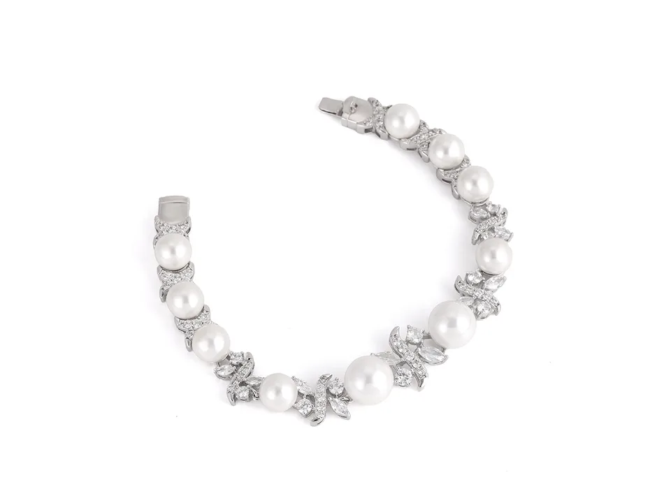 A pearl and zircon bracelet isolated on a white background.