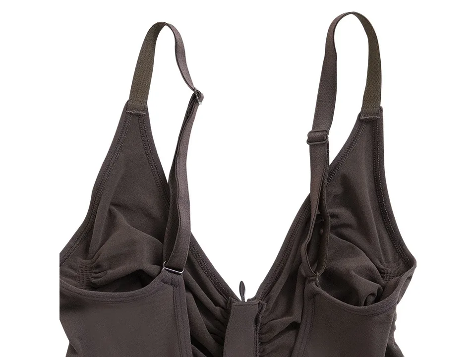Close-up of the adjustable straps and neckline of the shapewear.