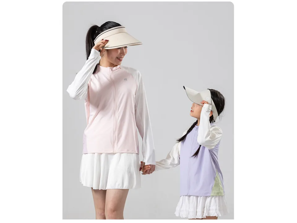 A woman and a young girl wearing sun protection jackets and visors.