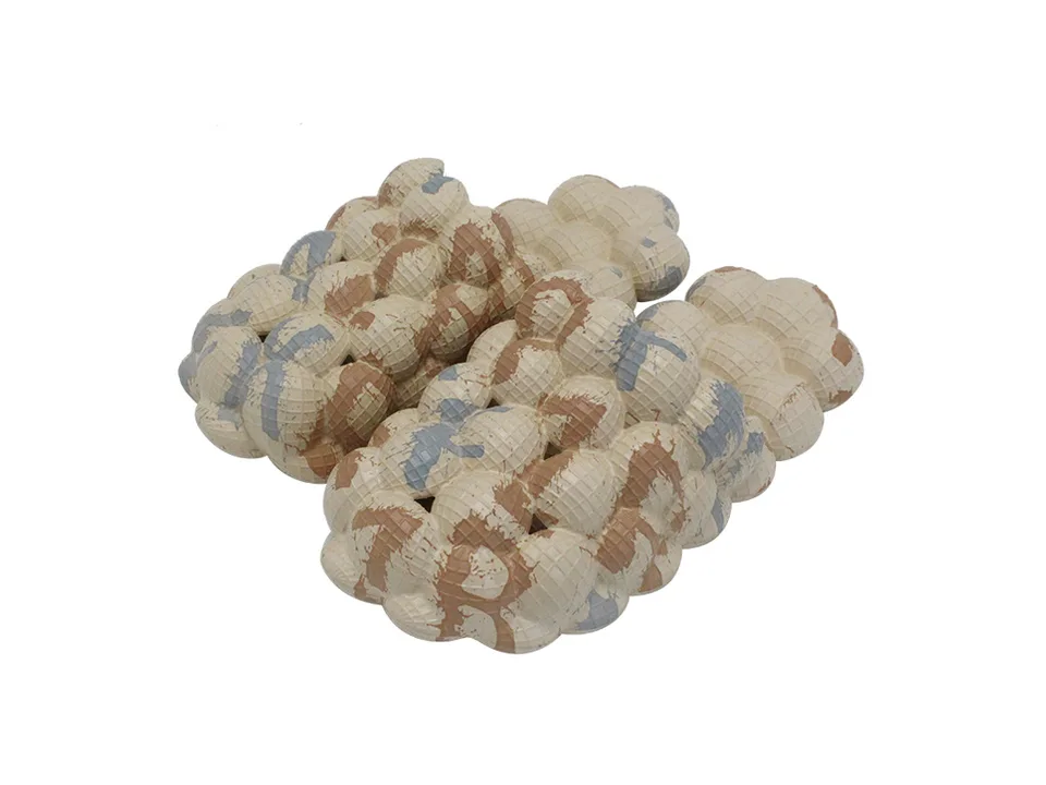 Beige bubble slides with brown and blue camouflage pattern.