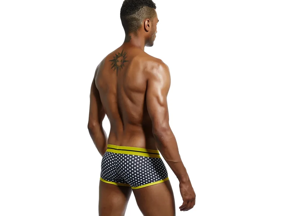 Back view of a man wearing star-print boxer briefs