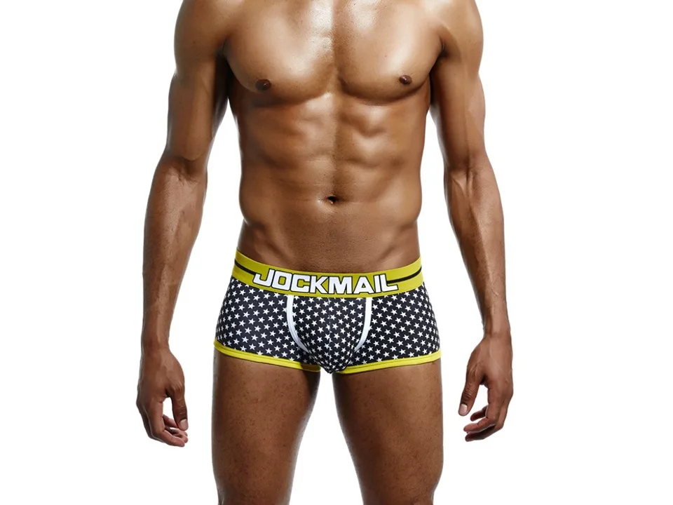 Front view of a man wearing star-print boxer briefs