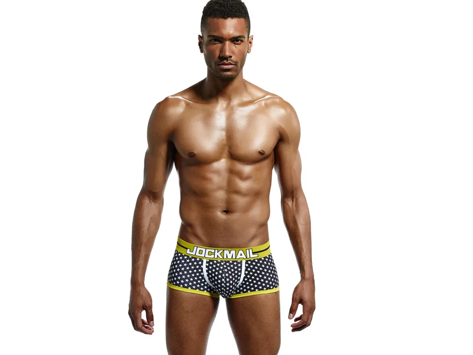 Front view of a man wearing star-print boxer briefs