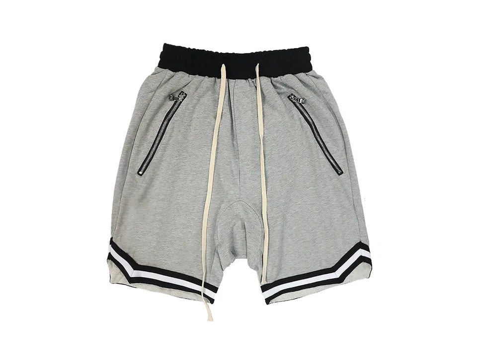 Light grey drawstring sweatshorts with zipper pockets and black and white athletic trim.