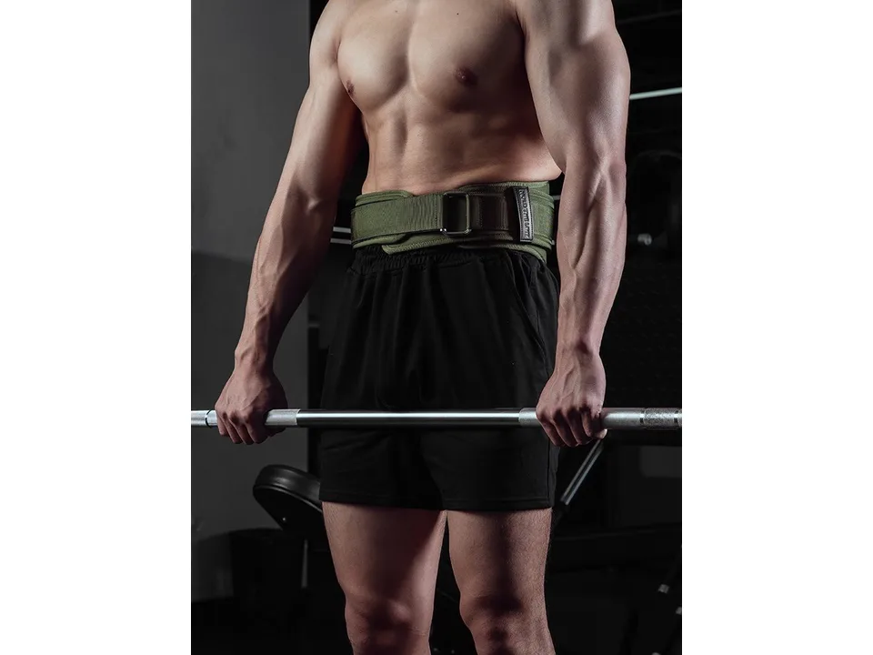 A man wearing a green weightlifting belt while holding a barbell.