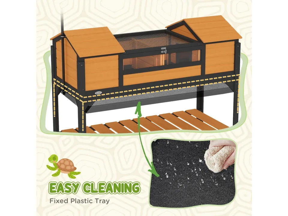 Close-up of the tortoise enclosure showing the removable plastic cleaning tray.