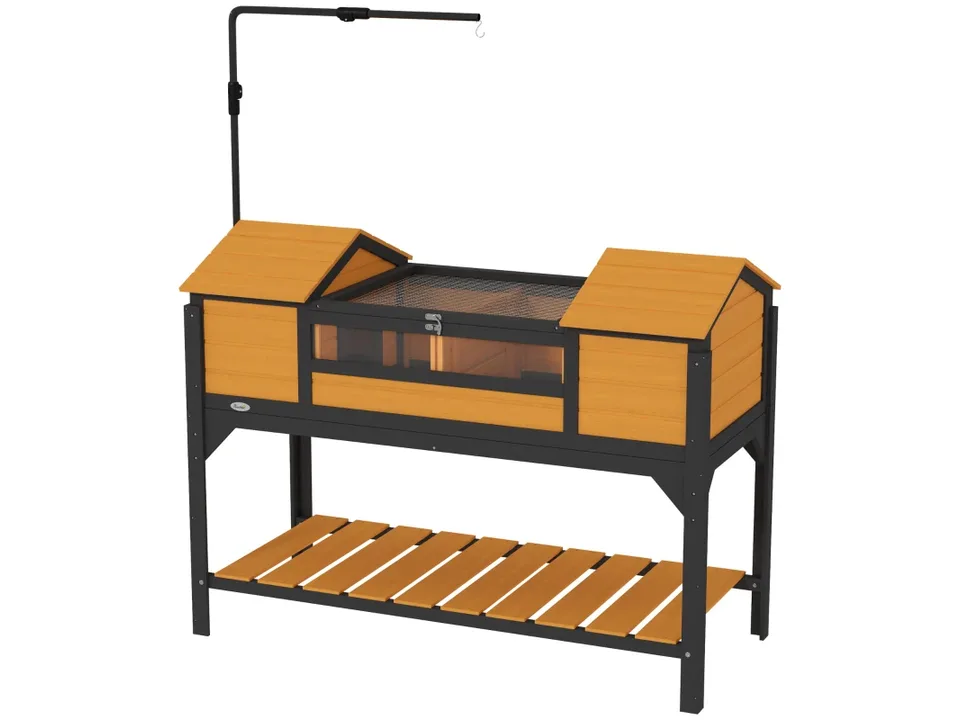 Tortoise enclosure with wooden frame, wire mesh top, and storage shelf.