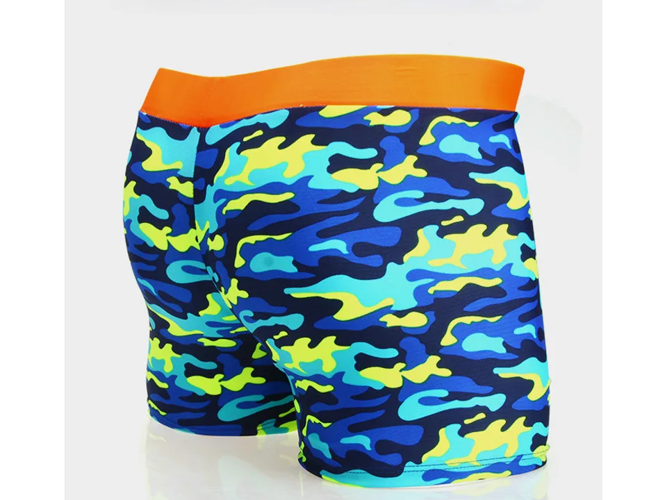 Children's swimming trunks with a blue camouflage pattern and orange waistband.