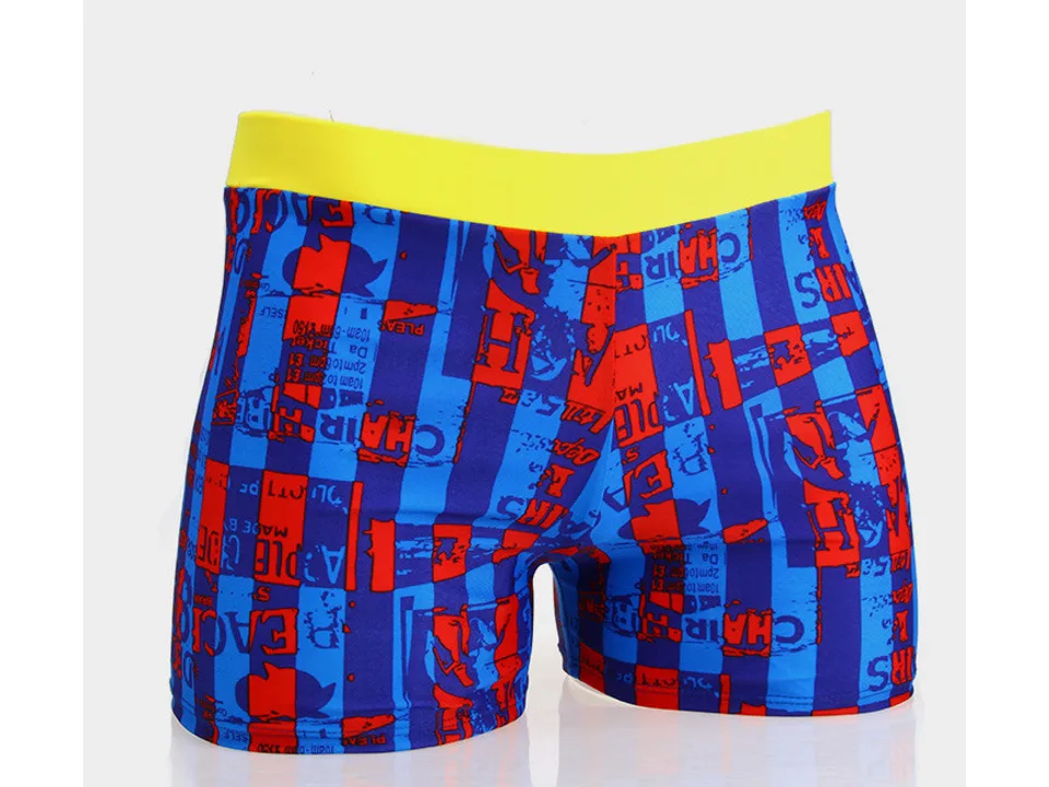 Children's swimming trunks with a blue and red graphic pattern and yellow waistband.