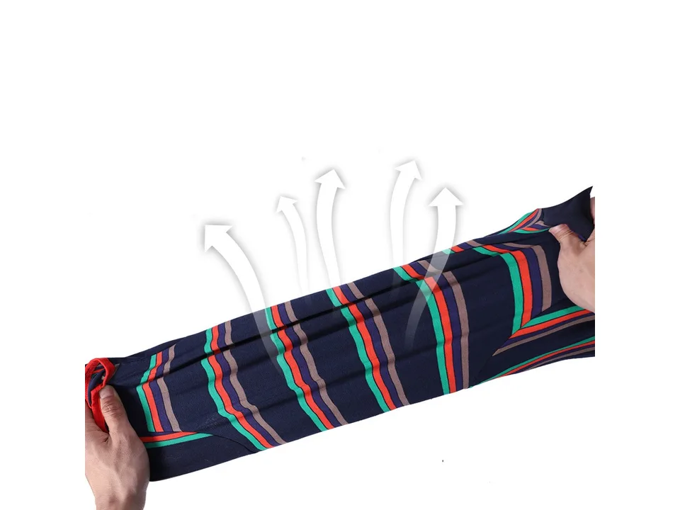 Hands stretching the fabric of the dog pajamas to show elasticity.
