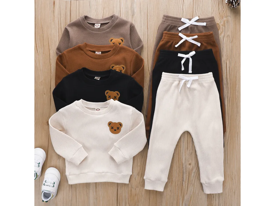 A set of four children's bear embroidered long-sleeved top and trousers sets in different colors.