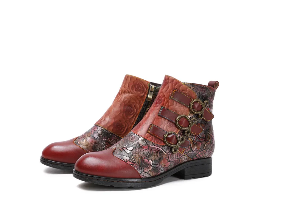 Pair of red floral print ankle boots with side buckles