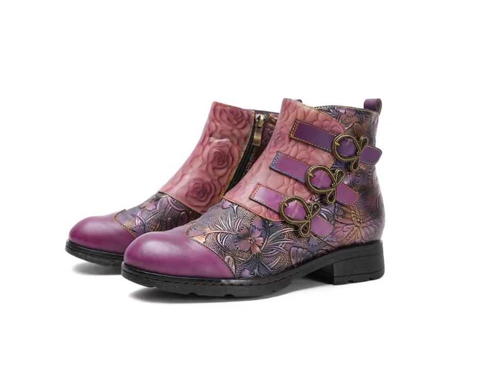 Pair of purple floral print ankle boots with side buckles