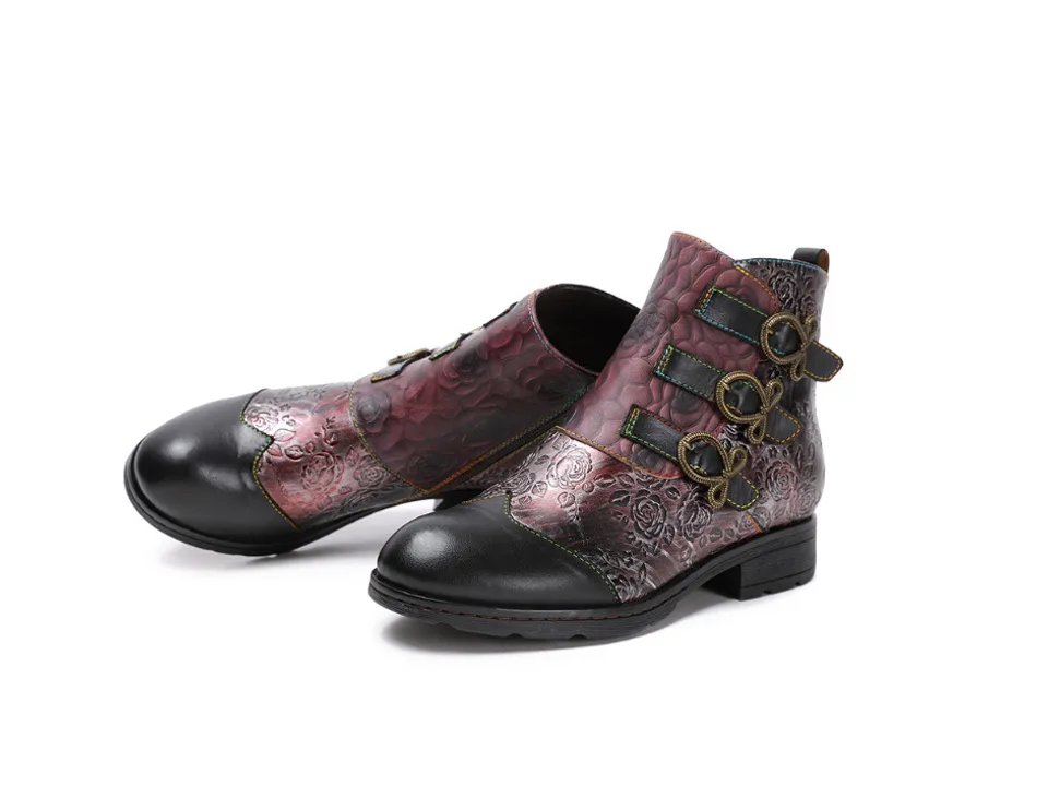 Pair of black and red floral print ankle boots with side buckles