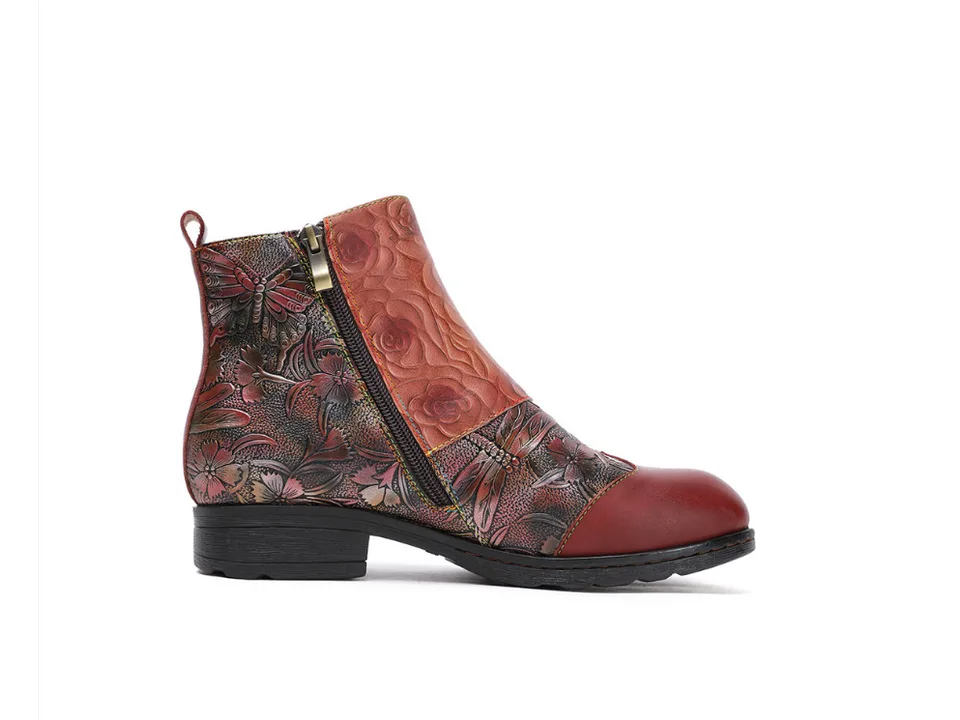Side view of a red floral print ankle boot with a side zipper