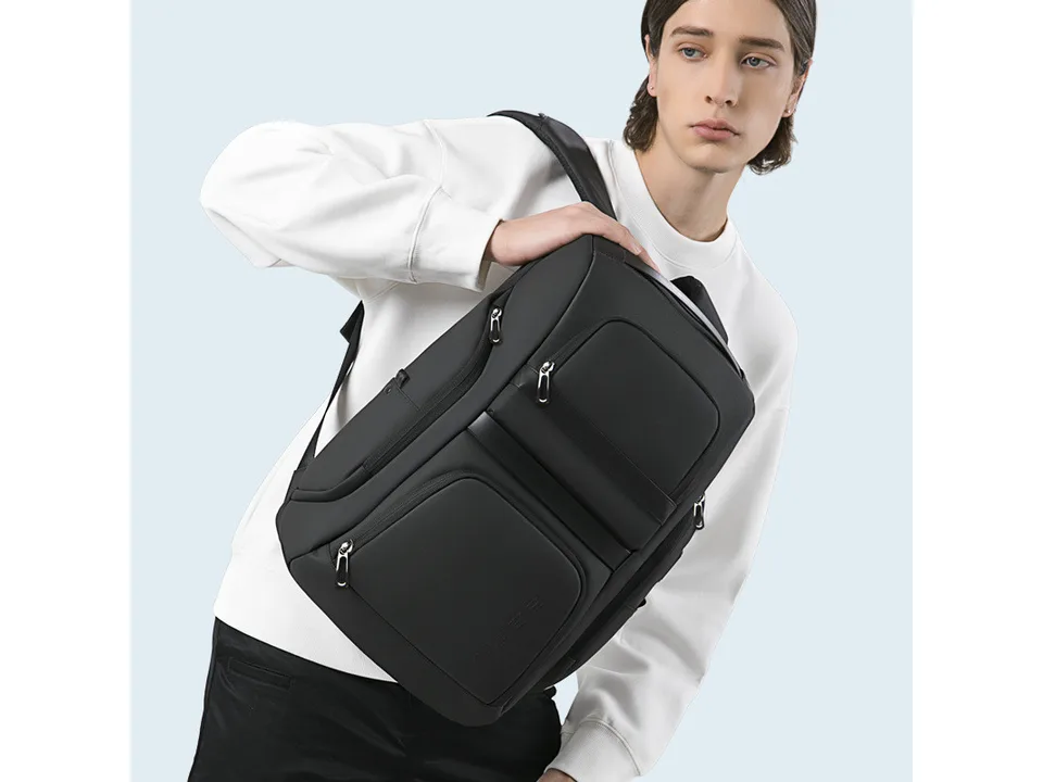 Person carrying the black business backpack