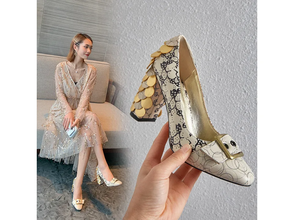 A woman wearing the beige chunky heel pumps with a matching dress.
