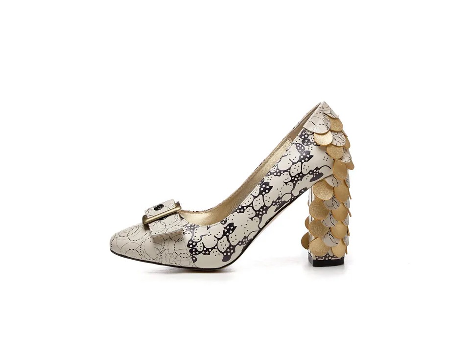 Side view of a single beige square-toe chunky heel pump with gold scale details on the heel.