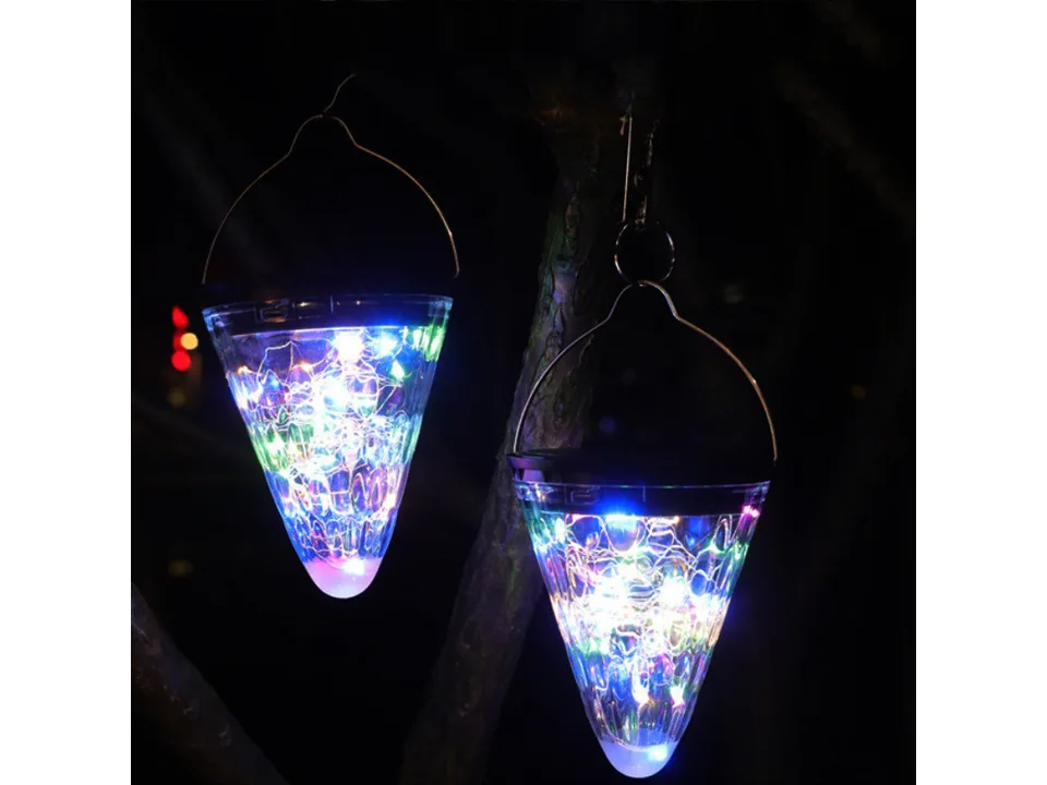 Two solar cone lights with multi-colored LED lights hanging at night.