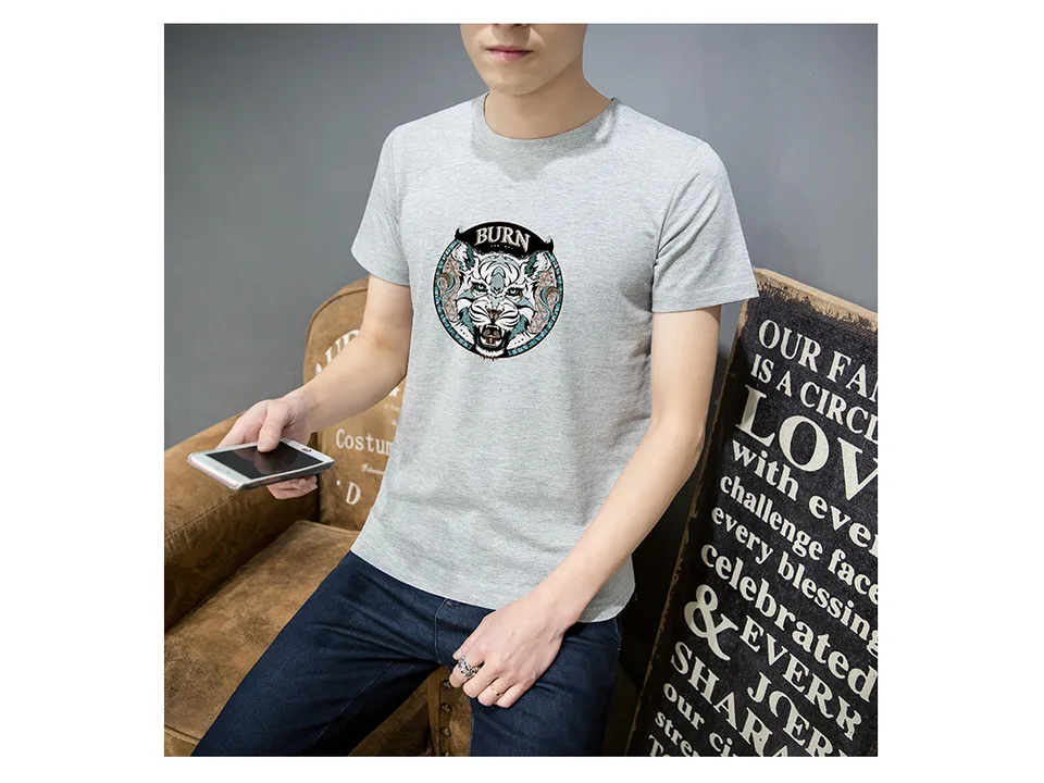 A man wearing a grey t-shirt with a tiger graphic print.