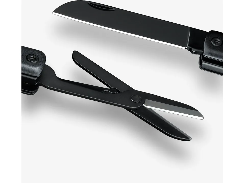 Close-up view of the multi-tool with the knife blade and scissors extended.