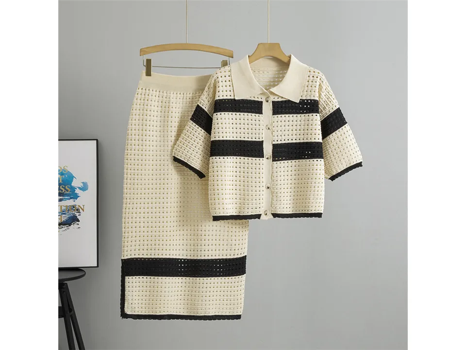 Full view of the knitted cardigan and midi skirt set hanging on a hanger.