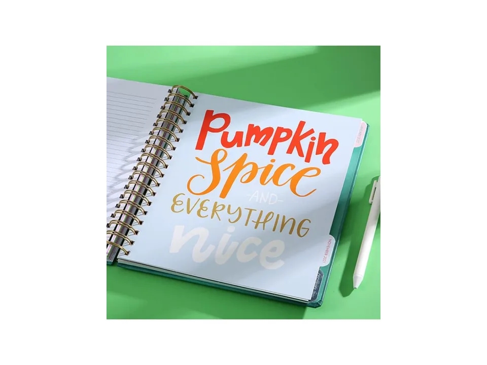 Open planner page with decorative text reading Pumpkin Spice and Everything Nice.