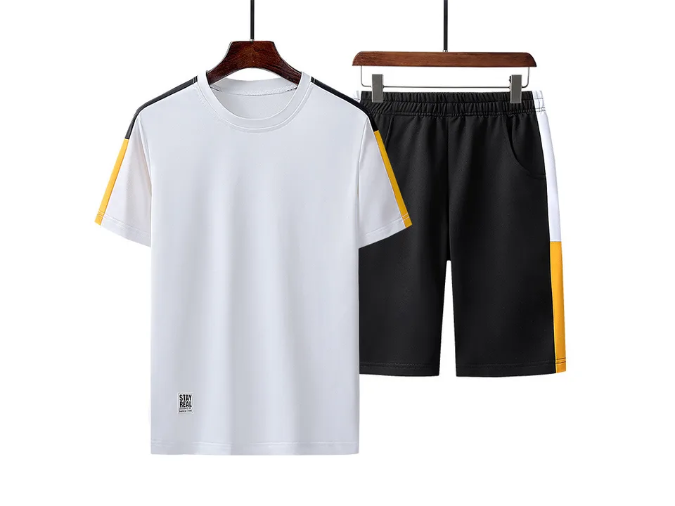White t-shirt and black shorts set with yellow and black side stripes.