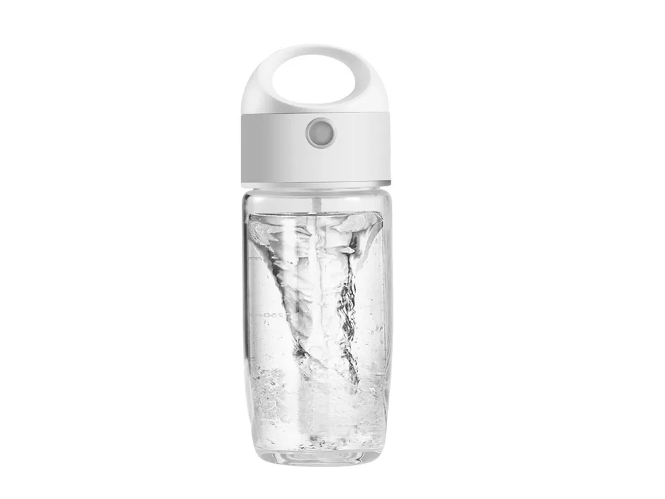 A single electric stirring cup with a clear glass body and white lid.