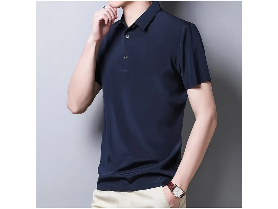 A man wearing a navy blue short-sleeve polo shirt, front view.