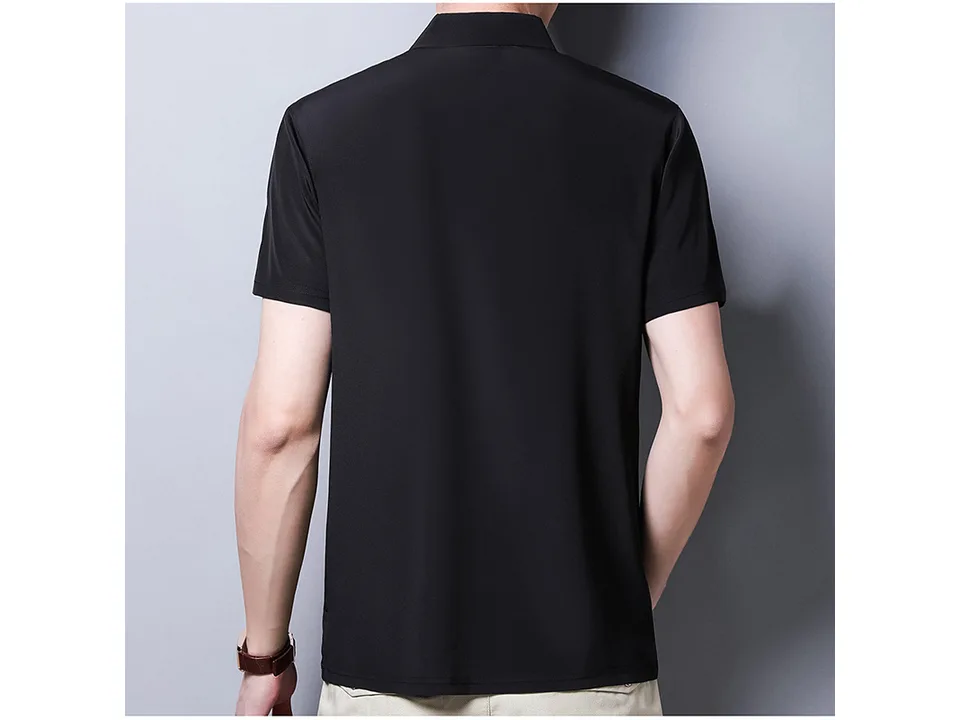 A man wearing a black short-sleeve polo shirt, back view.