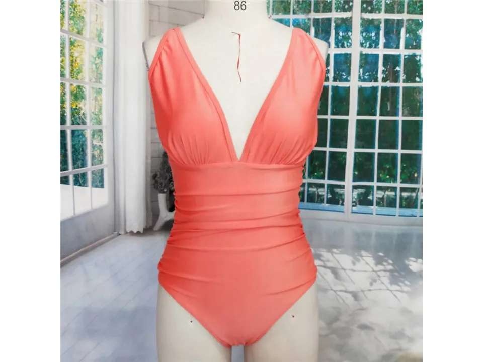 Coral one-piece swimsuit on a mannequin