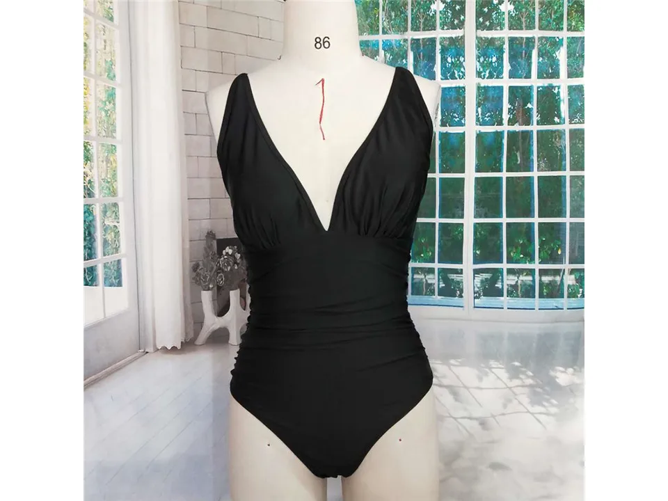 Black one-piece swimsuit on a mannequin
